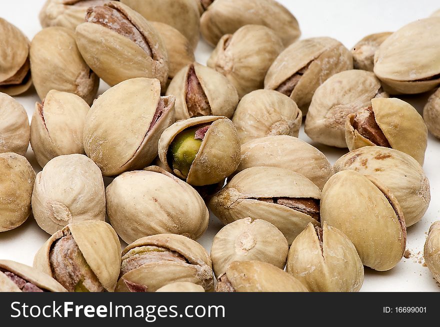 Pistachios very sensual on white background