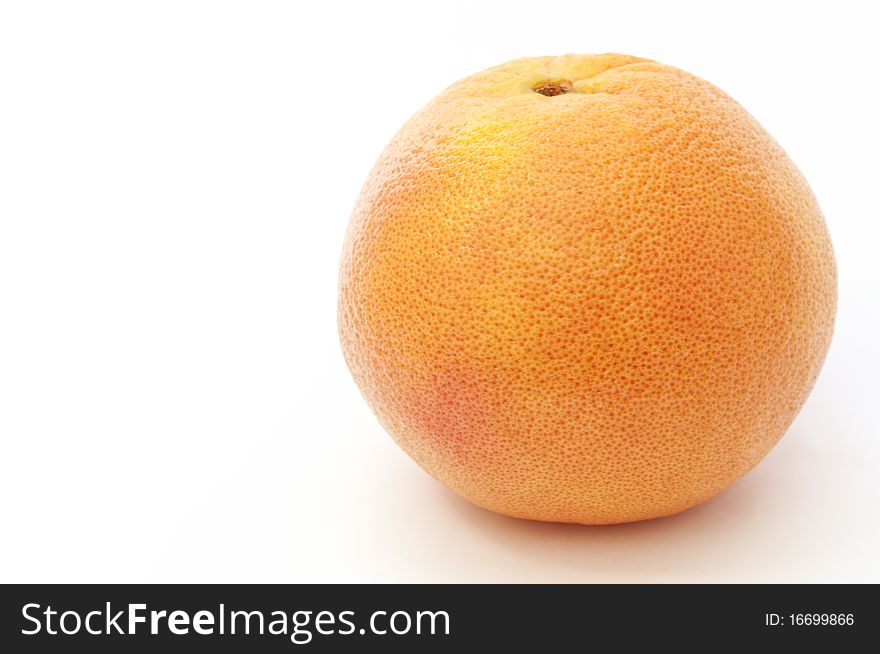 Red round whole ripe grapefruit isolated over white. Red round whole ripe grapefruit isolated over white