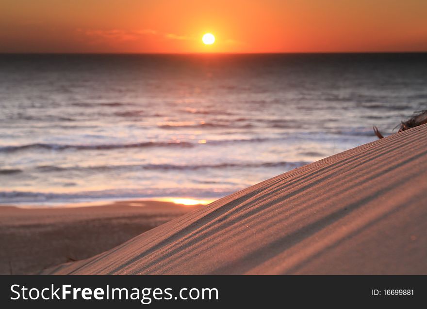 Sunset on french atlantic coast and dune