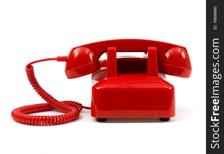 A rotary telephone isolated against a white background. A rotary telephone isolated against a white background