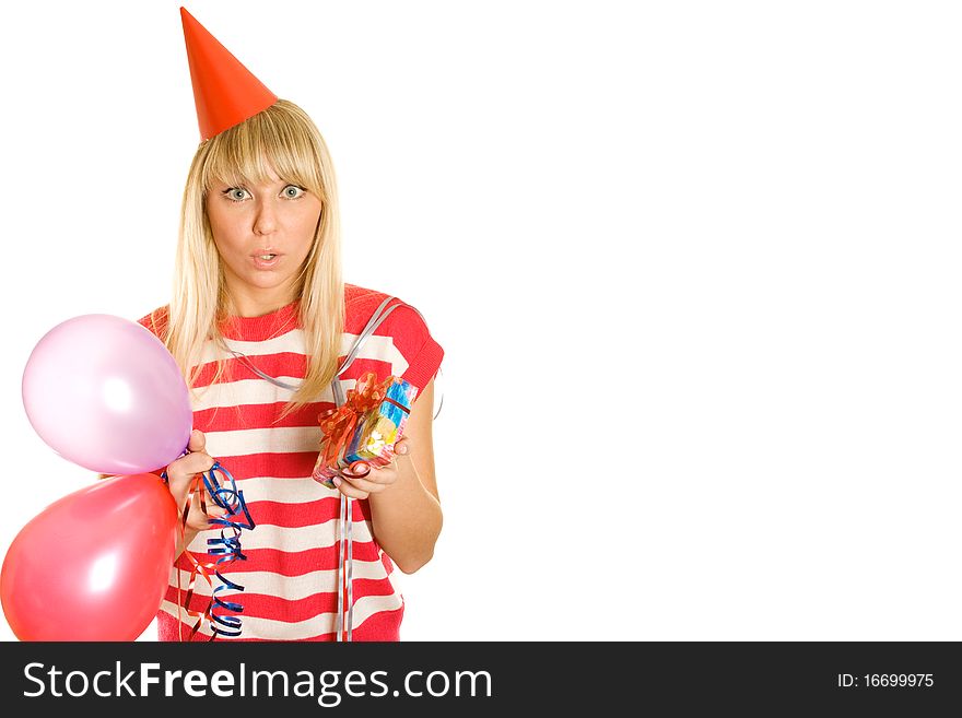 Portrait of a beautiful young woman celebrating her birthday in one hand and the other balls in gift box, paper hat on his head red. Lots of copyspace and room for text on this isolate. Portrait of a beautiful young woman celebrating her birthday in one hand and the other balls in gift box, paper hat on his head red. Lots of copyspace and room for text on this isolate