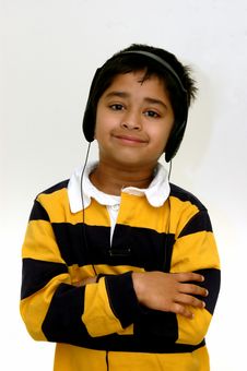 Kid Listening To Music Royalty Free Stock Photography