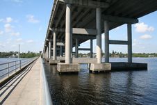 Tall Bridge And Long Fishing Pier Royalty Free Stock Photo