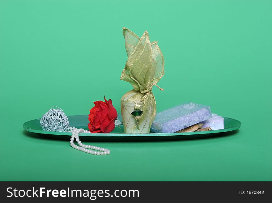 Spa items and red rose on green chroma key background. Spa items and red rose on green chroma key background