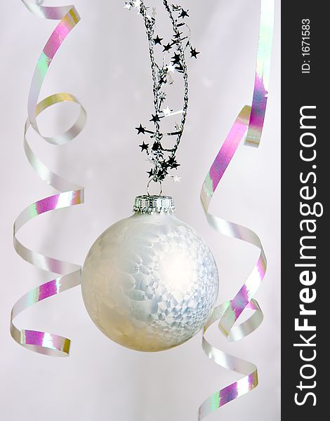 A single white christmas ball ornament. A single white christmas ball ornament