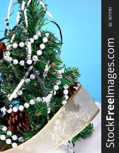 Decorated Christmas tree with blue background