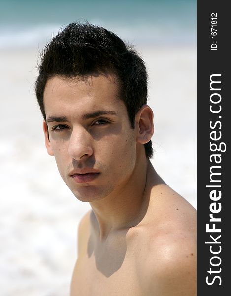 A young man having a vacation at the beach. A young man having a vacation at the beach