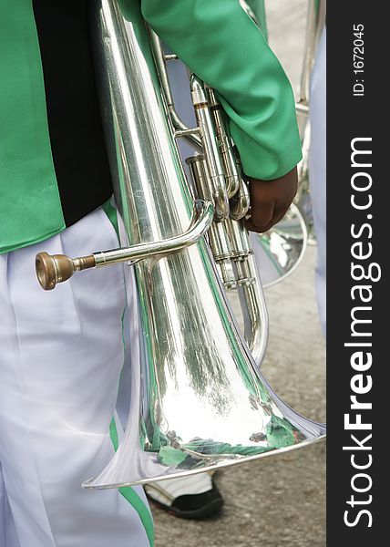 Close-up of a boy holding a trombone. Close-up of a boy holding a trombone