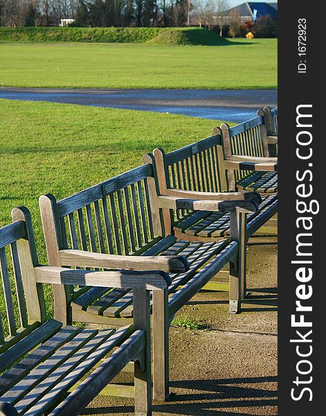 Row of deserted benches in park. Row of deserted benches in park