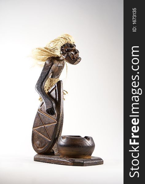 Ancient figure of surfer made by wood