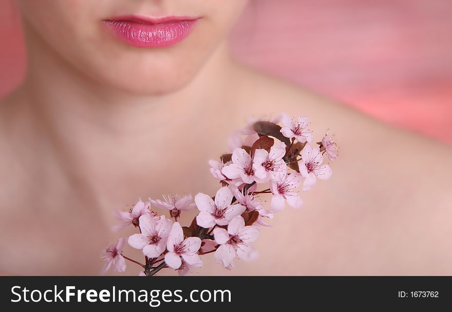 Pink - tone photography of lips and spring flowers. Pink - tone photography of lips and spring flowers