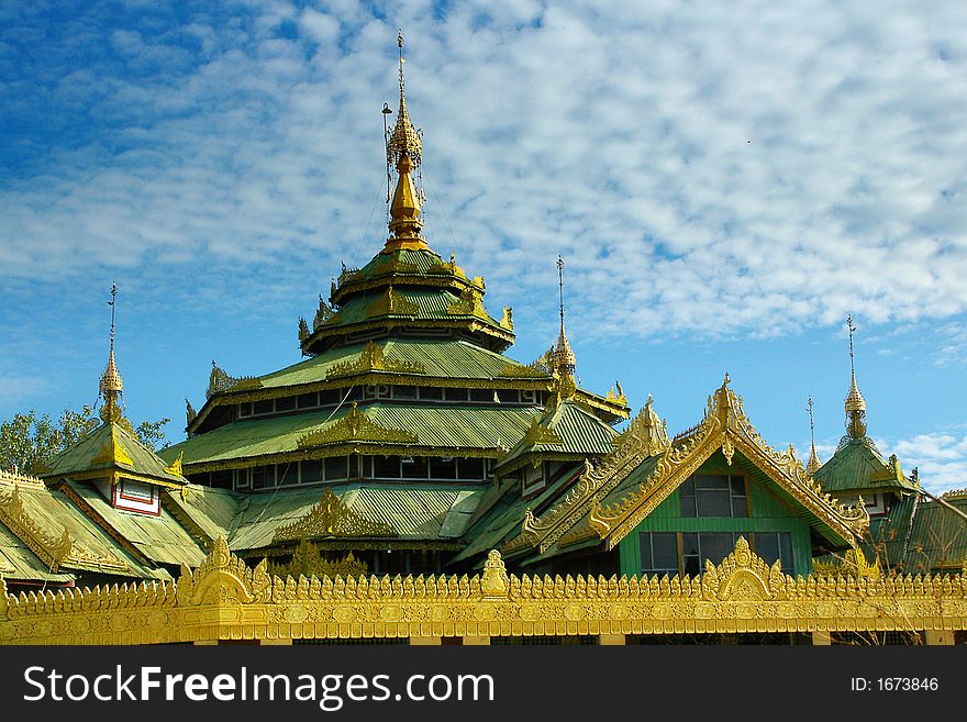 Buddhist temple on bright sky background