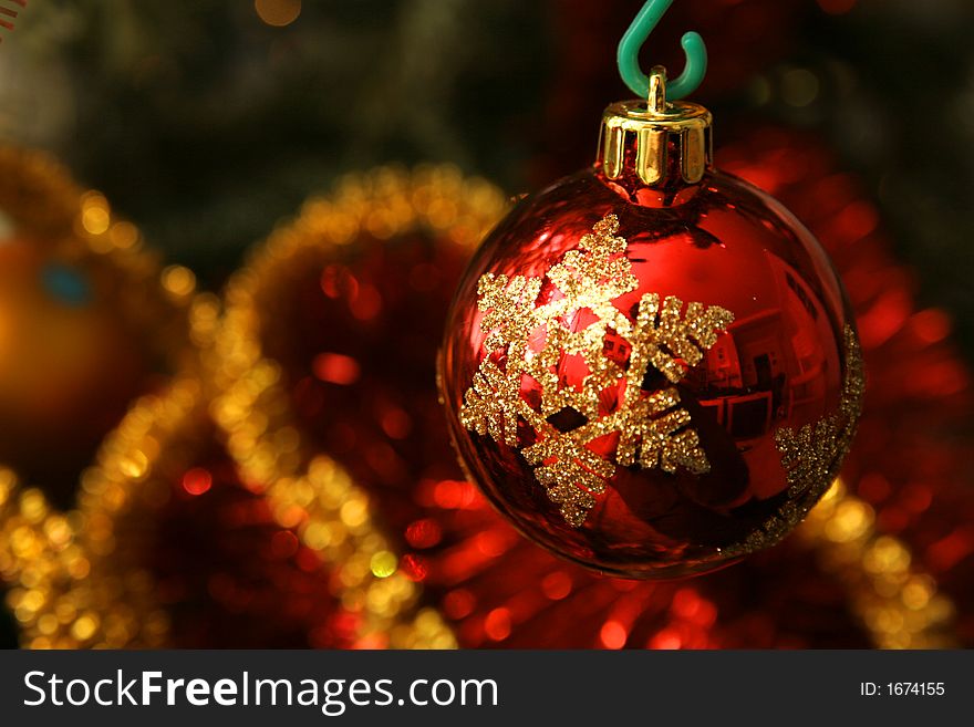 Red glass ball on the Christmas tree, interesting design. Red glass ball on the Christmas tree, interesting design.