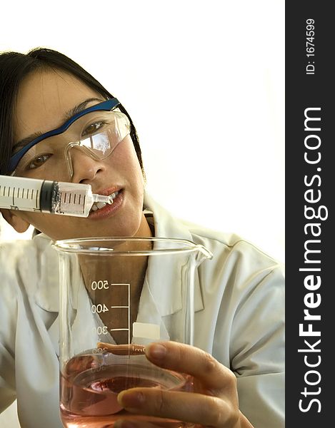 Female worker/scientist examining product on white background