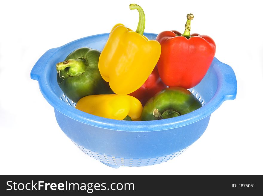 Some colored peppers in a blue bowl