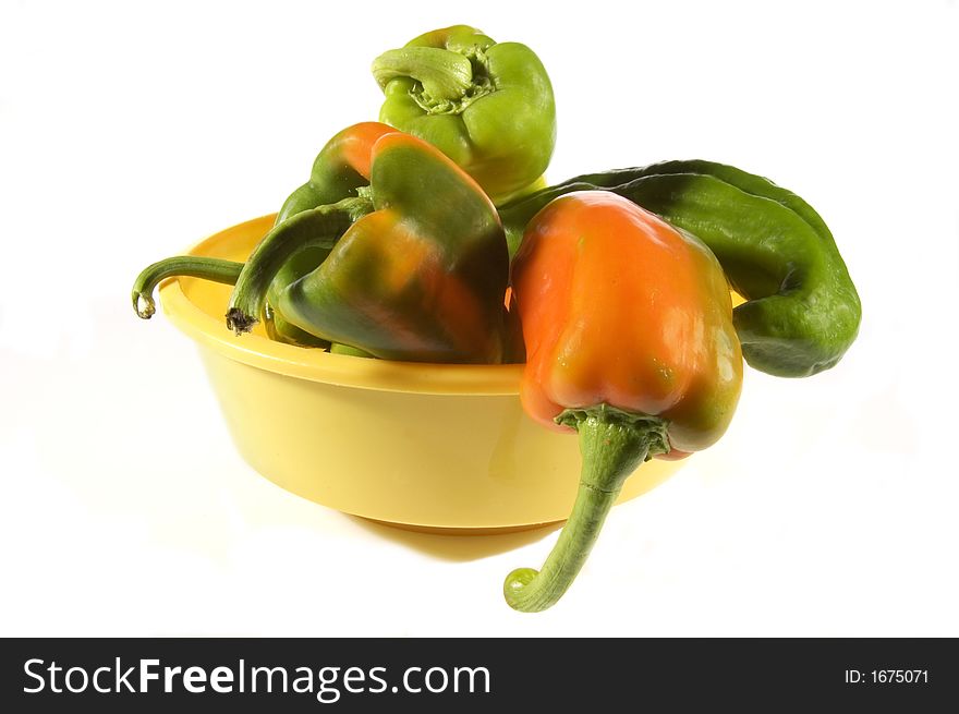 Some colored peppers on a white background