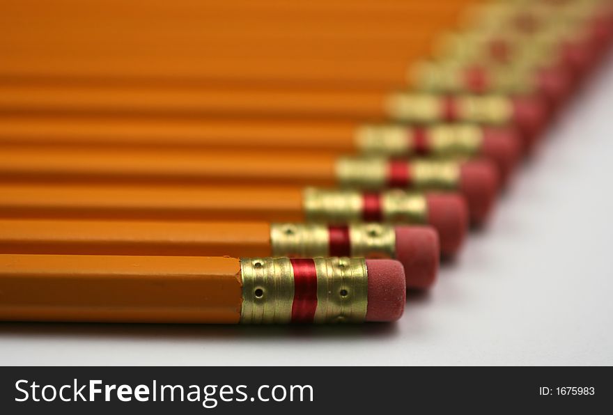 Lots of pencils all lined up going off into the horizon. Lots of pencils all lined up going off into the horizon.