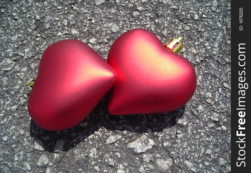 Closeup of two loving hearts made of christmas decoration symbolising love and romance