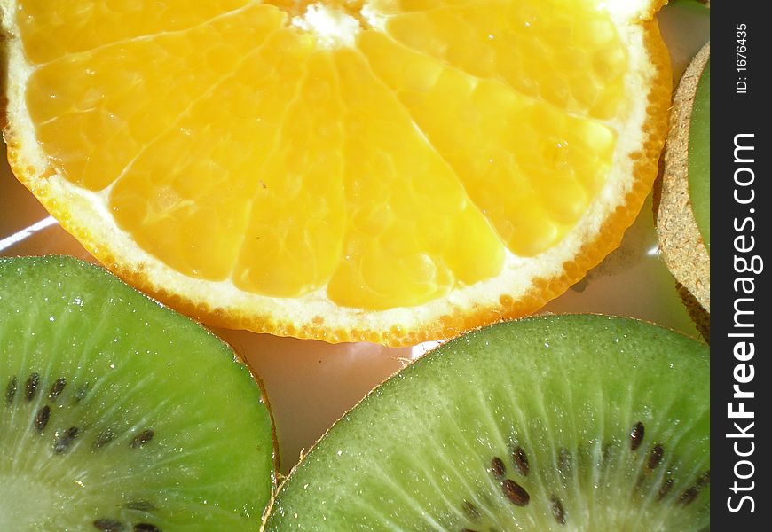 Close-up of pieces of kiwi and orange