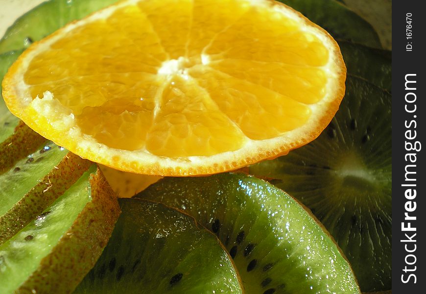 Close-up of kiwi and orange pieces