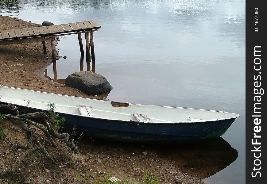 On coast of lake boats, water