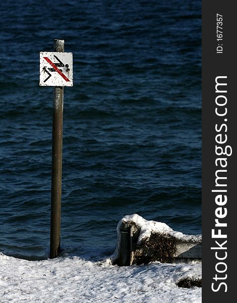 Sign no jumping in the water in winter