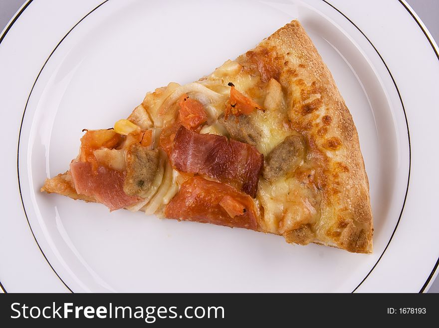 Close up of a pizza on a plate.