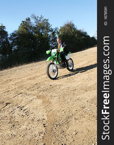 Businessman On Dirt Bike