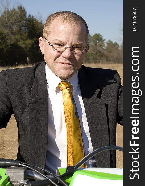 Businessman On Dirt Bike