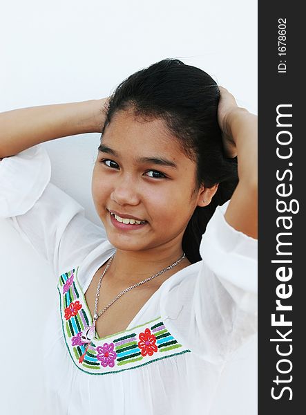 Portrait of a beautiful Thai girl in a white shirt
