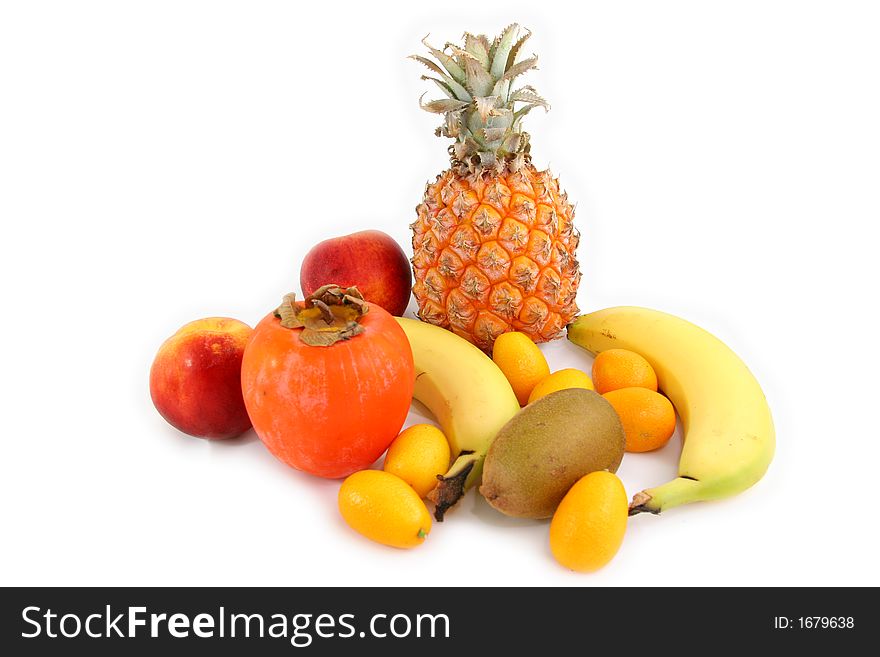 Several tropical fruits arranged over a white beackground