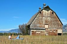 Old Abandoned Barn With Broken Snowmobile Stock Images