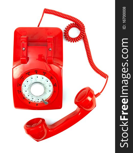 A rotary telephone hand set isolated against a white background. A rotary telephone hand set isolated against a white background