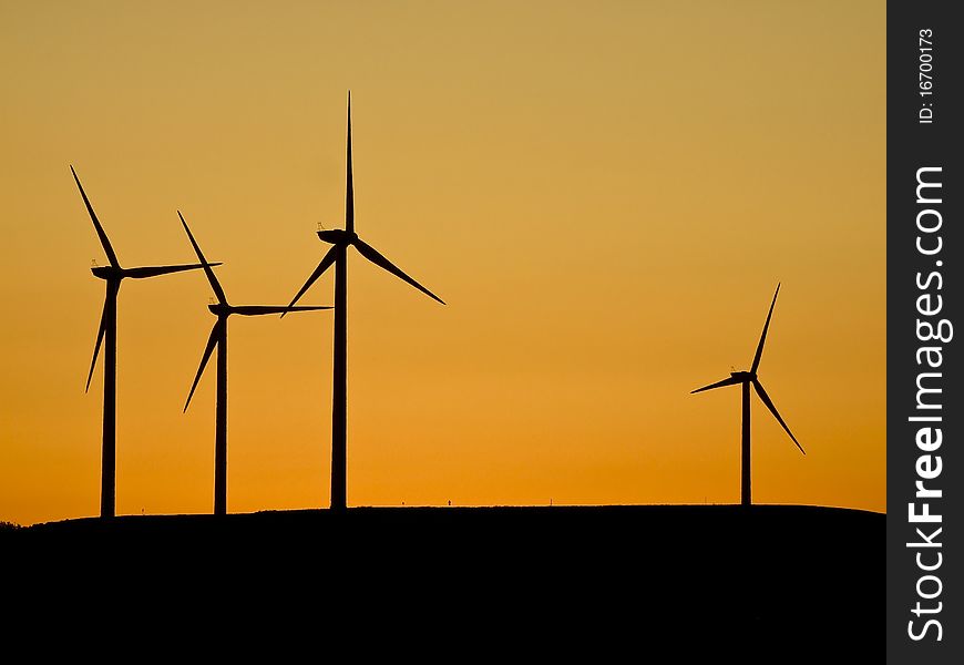 Wind turbines at sunset (sihlouette). Wind turbines at sunset (sihlouette)