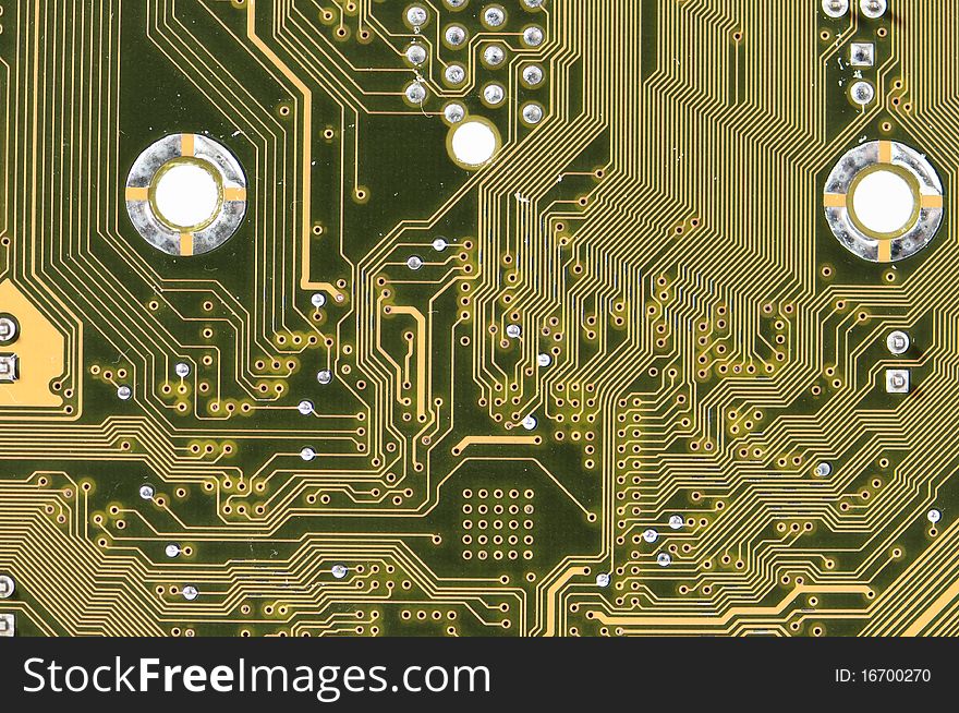 Electronic circuits on lower surface of a motherboard. Electronic circuits on lower surface of a motherboard