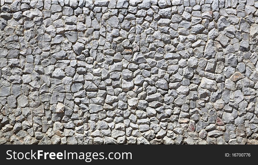 Modern white Brick Wall made of fragment stones in irregular shapes