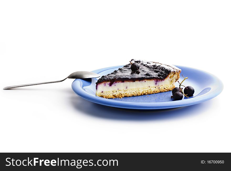 A slice of Blueberries Tart with Black Currant On White Background. A slice of Blueberries Tart with Black Currant On White Background