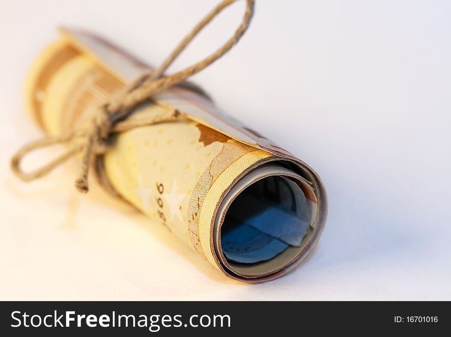 A roll of different Euro bills, tied with a cord. A roll of different Euro bills, tied with a cord.