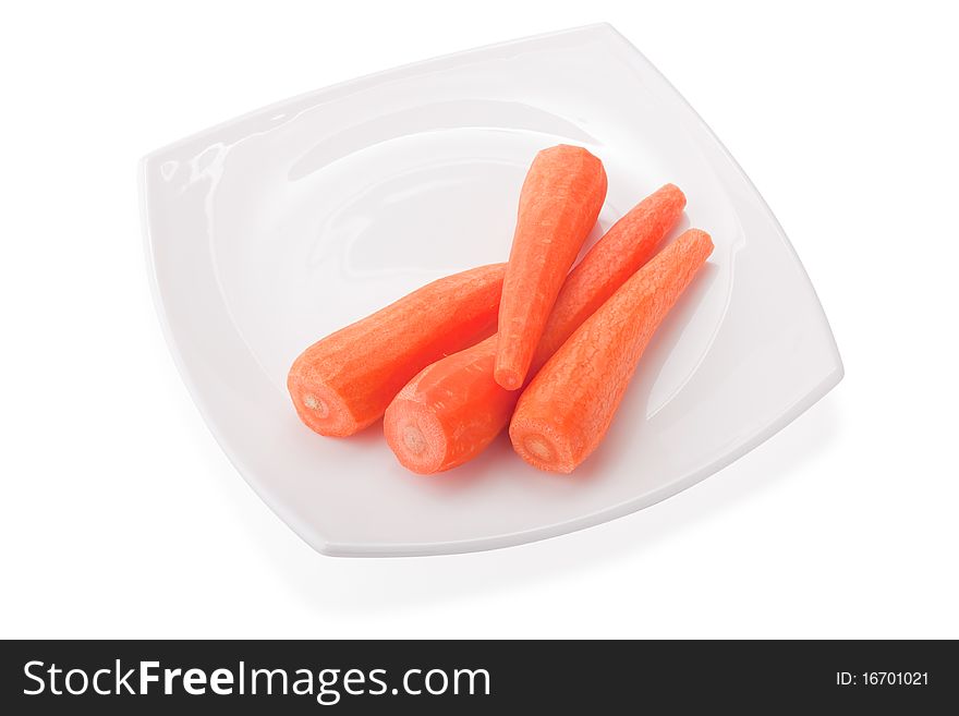Carrots on white plate, isolated on white