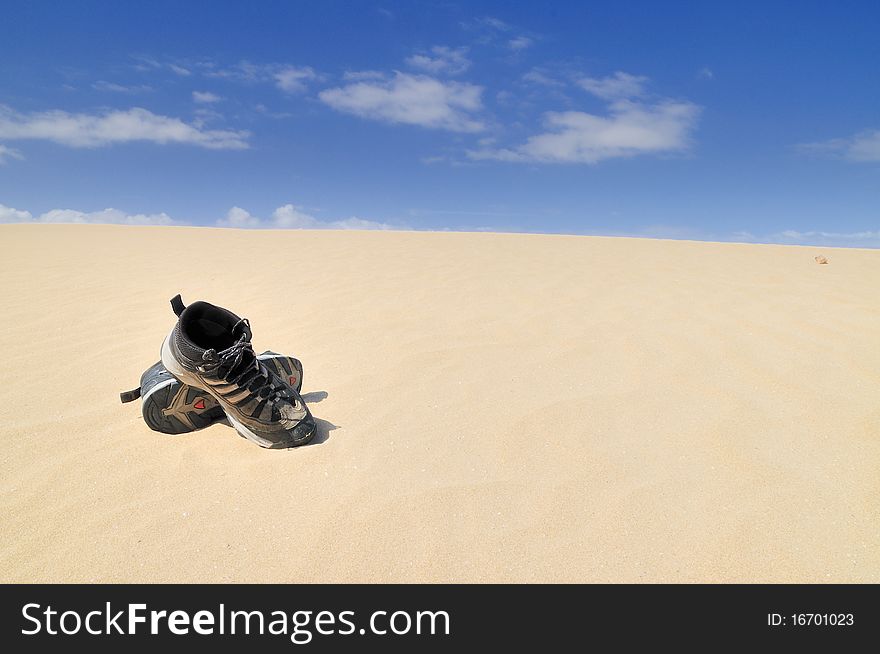 Boots on the sand.  Balck boots in the Desert