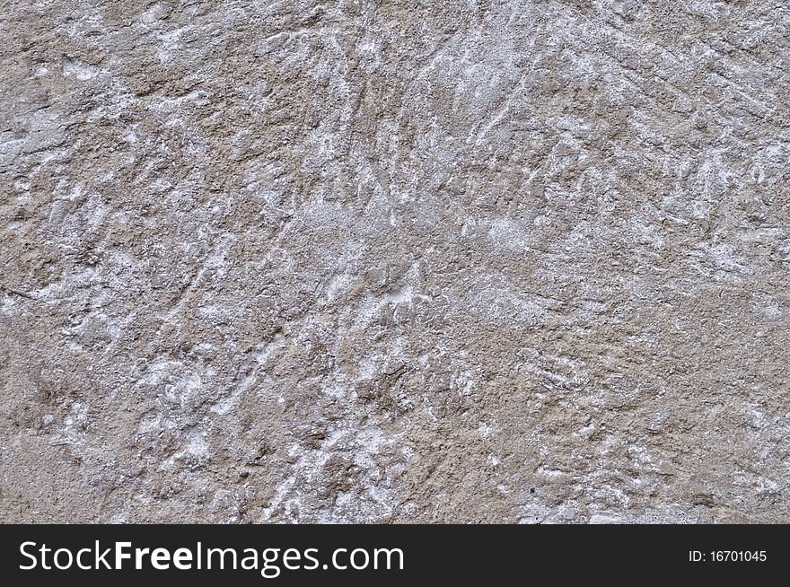 Fragment of scratched gray cement wall background. Fragment of scratched gray cement wall background