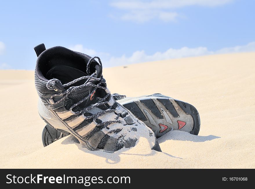 Boots on the sand. Balck boots in the Desert