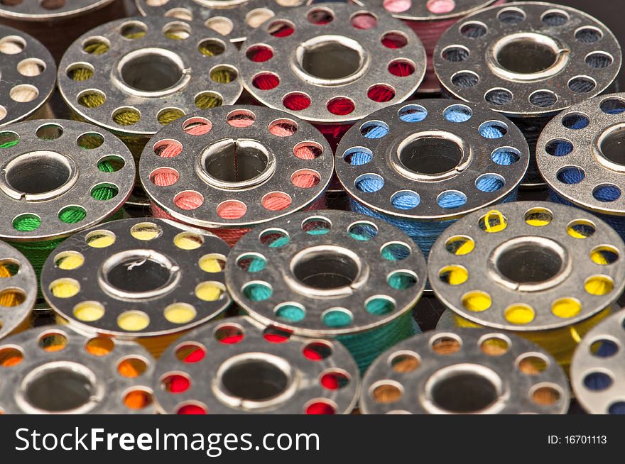 Colorful spools of yarn in a close-up