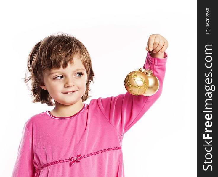 Little girl playing with  Christmas balls