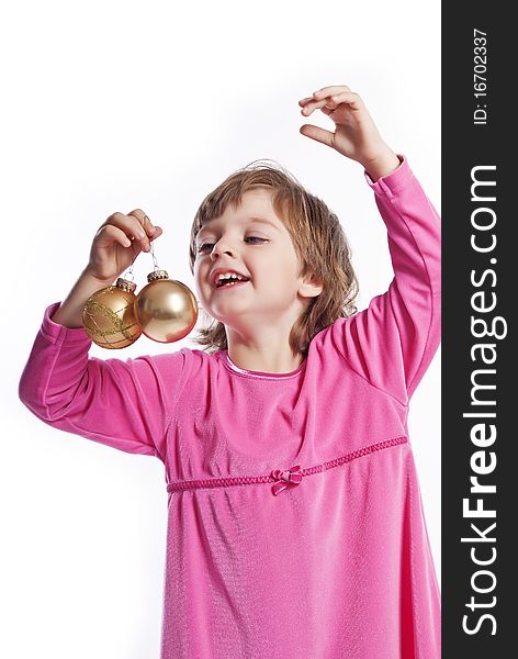 Girl three years old with christmas balls isolated on white. Girl three years old with christmas balls isolated on white