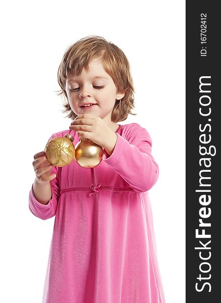 Little girl holding golden christmas balls