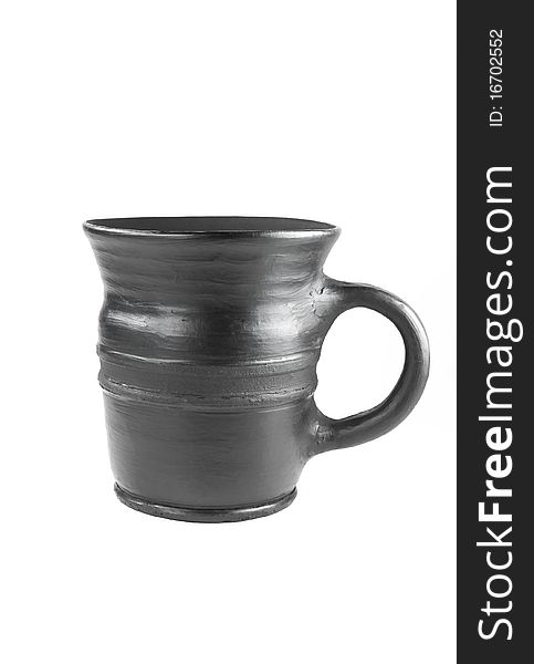 A black ceramic teacup isolated over white. A black ceramic teacup isolated over white