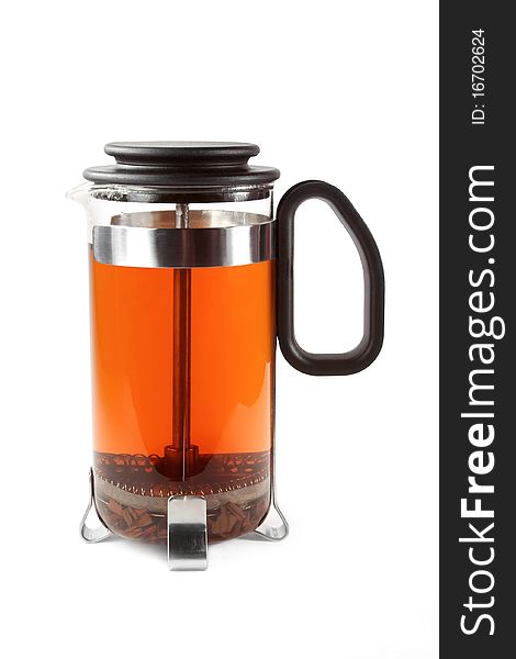 French press with hot tea over white. French press with hot tea over white