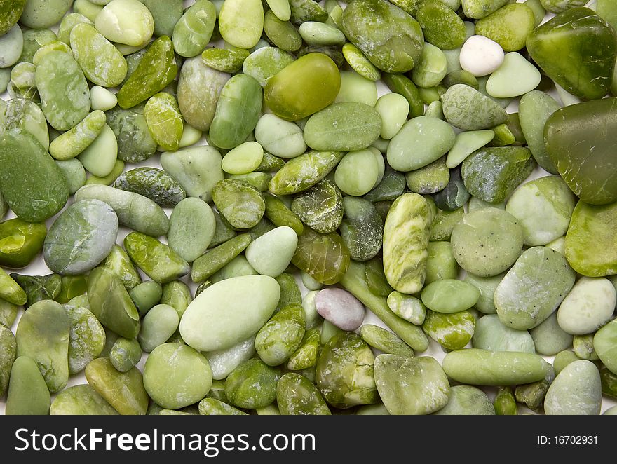 Small green nephrite stones background