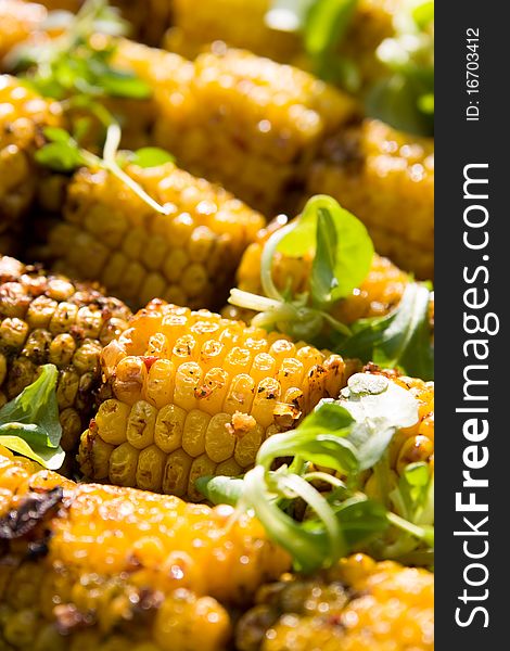 A close-up of delicious grilled yellow corncobs